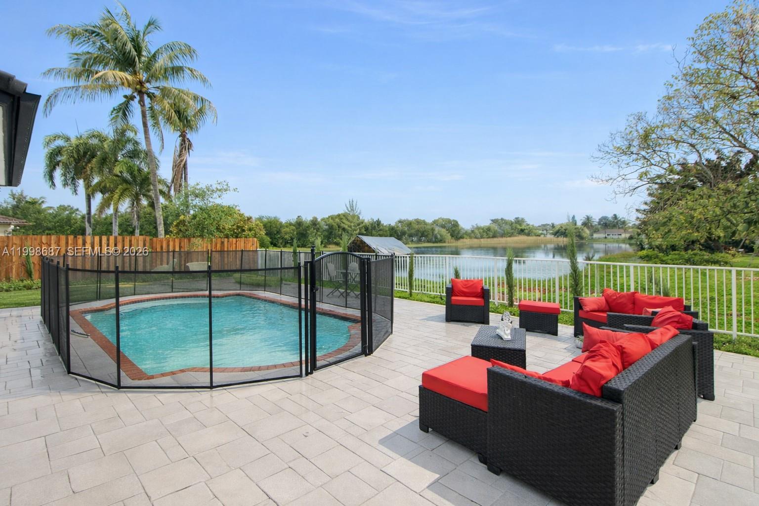 15045 Southwest 38th Terrace Miami, FL 33185 - Photo 33 of 37 an outdoor sitting area with furniture and outdoor seating