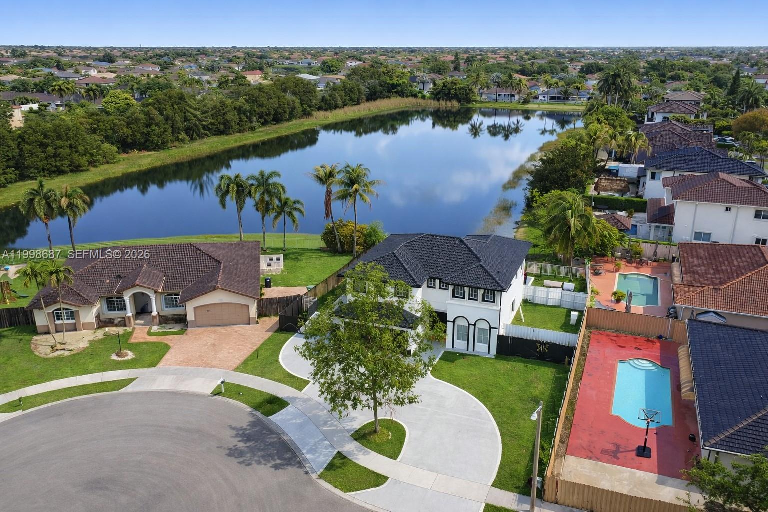 15045 Southwest 38th Terrace Miami, FL 33185 - Photo 6 of 37 an aerial view of a house with a lake view