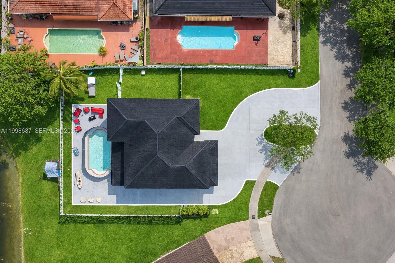 15045 Southwest 38th Terrace Miami, FL 33185 - Photo 8 of 37 an aerial view of a house with garden space and street view