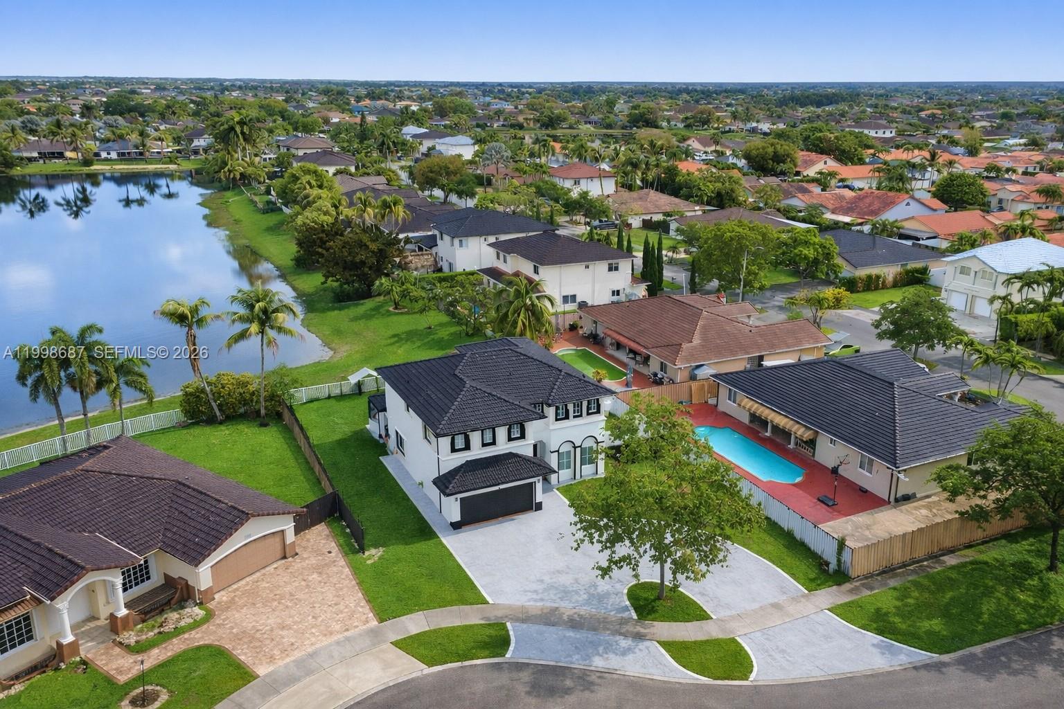 15045 Southwest 38th Terrace Miami, FL 33185 - Photo 9 of 37 an aerial view of a house with a garden