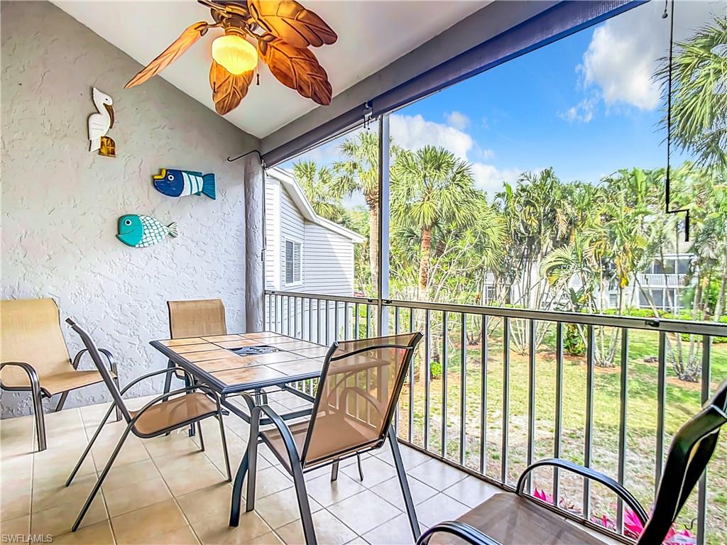 2860 Citrus Lake Drive, Unit R202 Naples, FL 34109 - Photo 44 of 50 a view of a chairs and table in patio