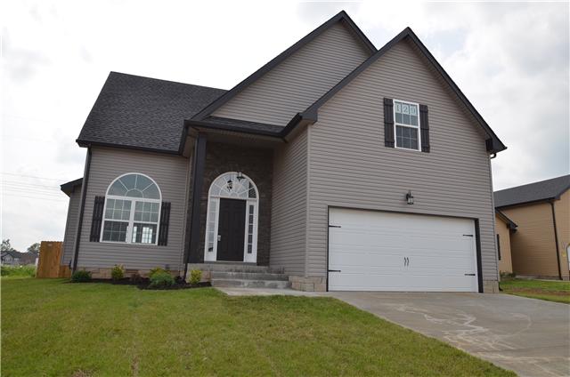 129 Whitetail Ridge Clarksville, TN 37040 - Photo 1 of 20 a front view of a house with a garden