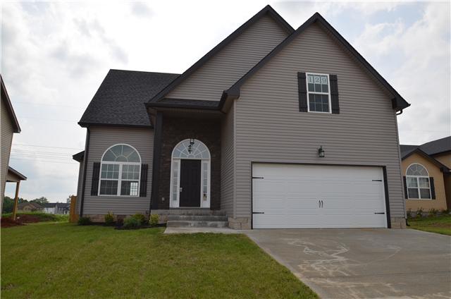 129 Whitetail Ridge Clarksville, TN 37040 - Photo 2 of 20 a front view of a house with a garden