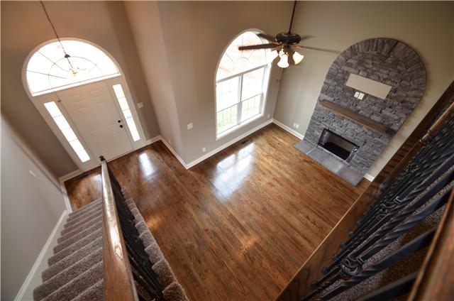 129 Whitetail Ridge Clarksville, TN 37040 - Photo 8 of 20 a view of an empty room with wooden floor and a fireplace
