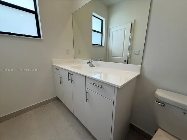 a view of bathroom with a sink and a toilet
