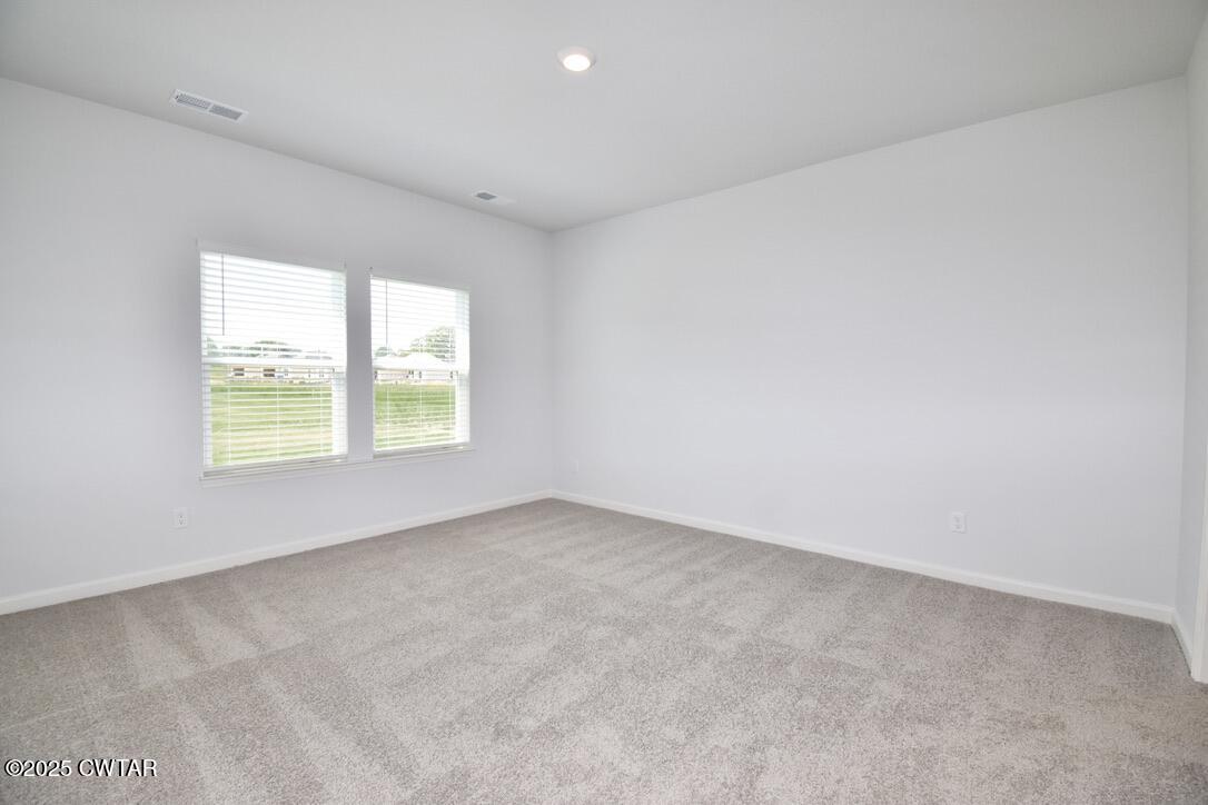 54 Clarendon Cove Jackson, TN 38305 - Photo 11 of 16 an empty room with windows
