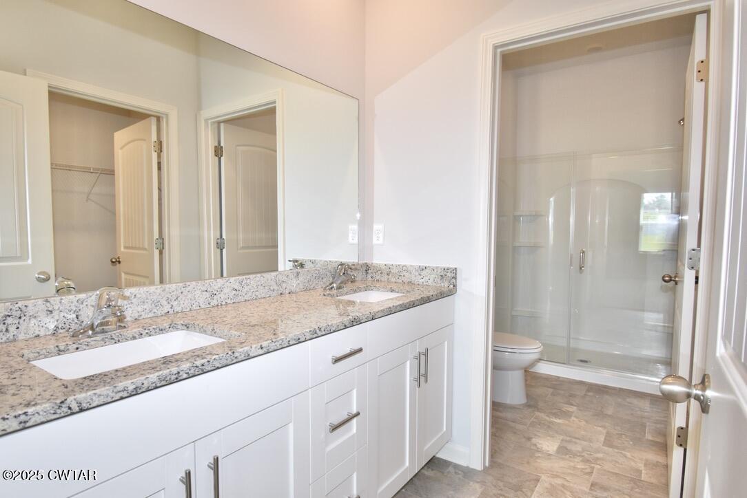 54 Clarendon Cove Jackson, TN 38305 - Photo 12 of 16 a bathroom with a granite countertop sink toilet and shower