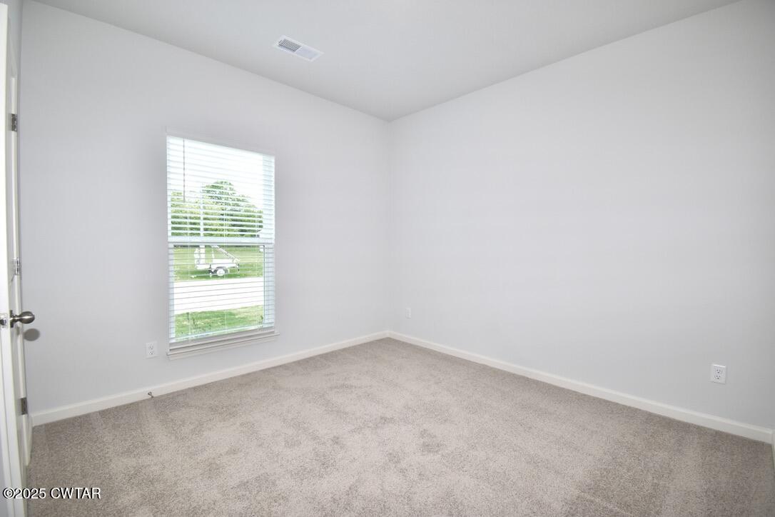 54 Clarendon Cove Jackson, TN 38305 - Photo 13 of 16 an empty room with a window