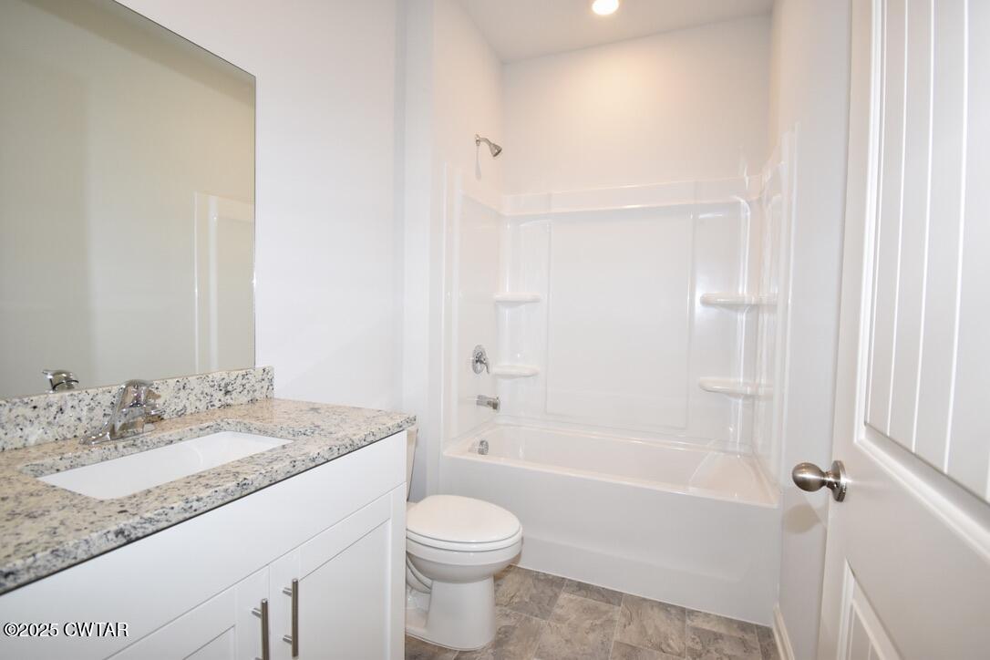 54 Clarendon Cove Jackson, TN 38305 - Photo 14 of 16 a bathroom with a granite countertop sink toilet and shower