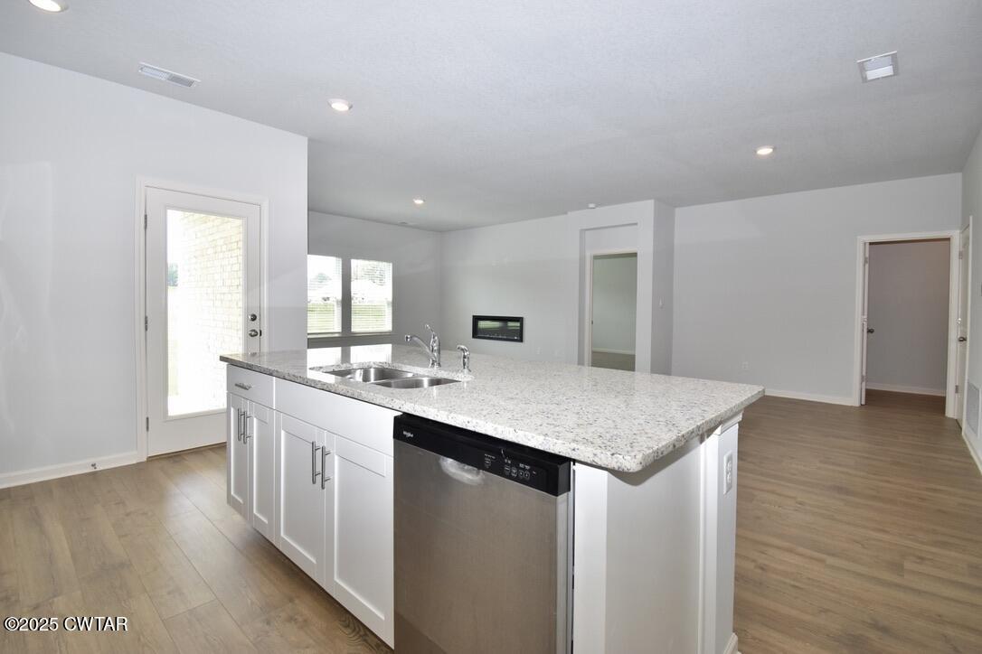54 Clarendon Cove Jackson, TN 38305 - Photo 7 of 16 a kitchen with sink cabinets and wooden floor