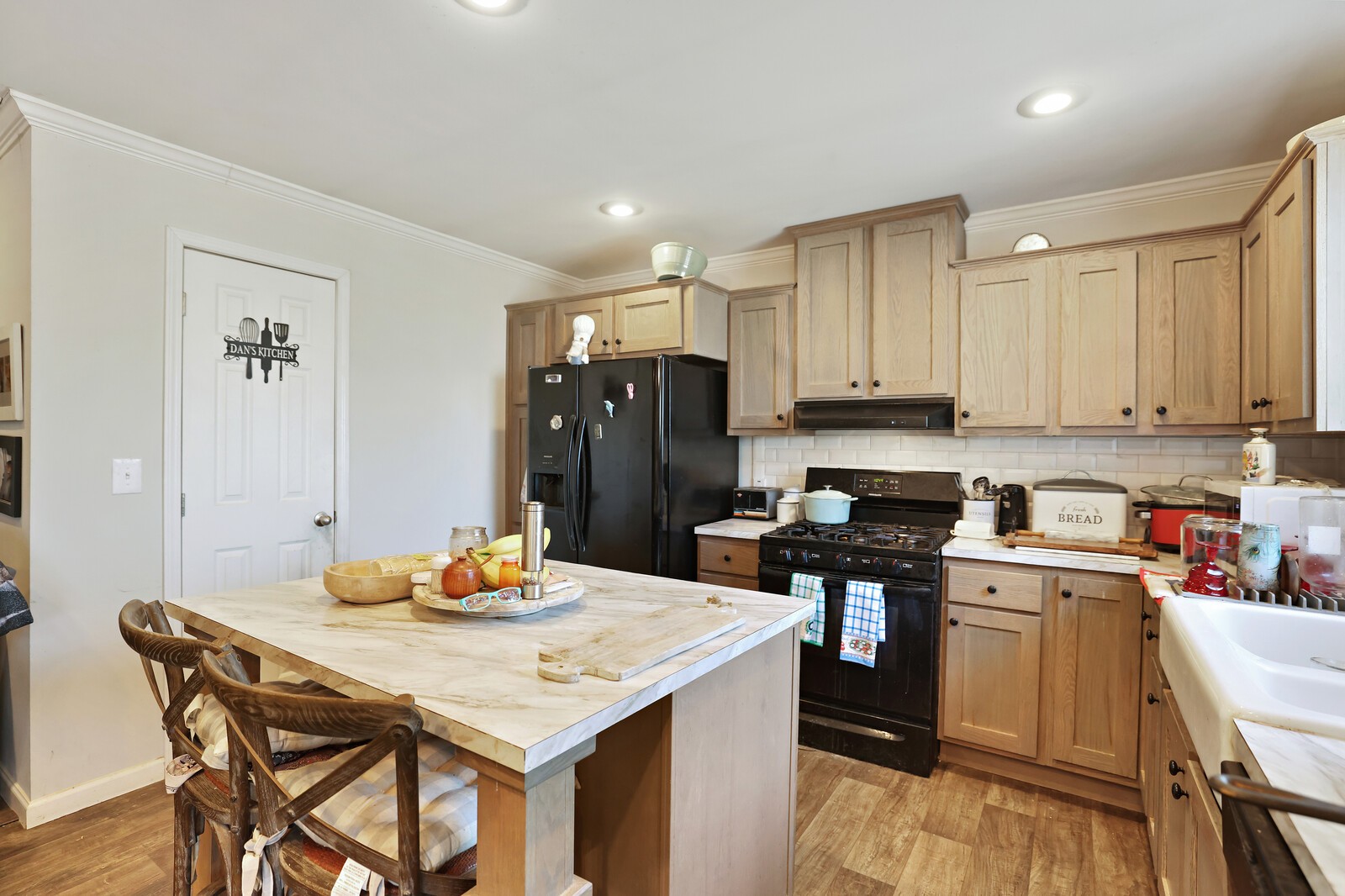 30195 White Oak Road Crawford, TN 38554 - Photo 16 of 54 a kitchen with a table chairs refrigerator and cabinets