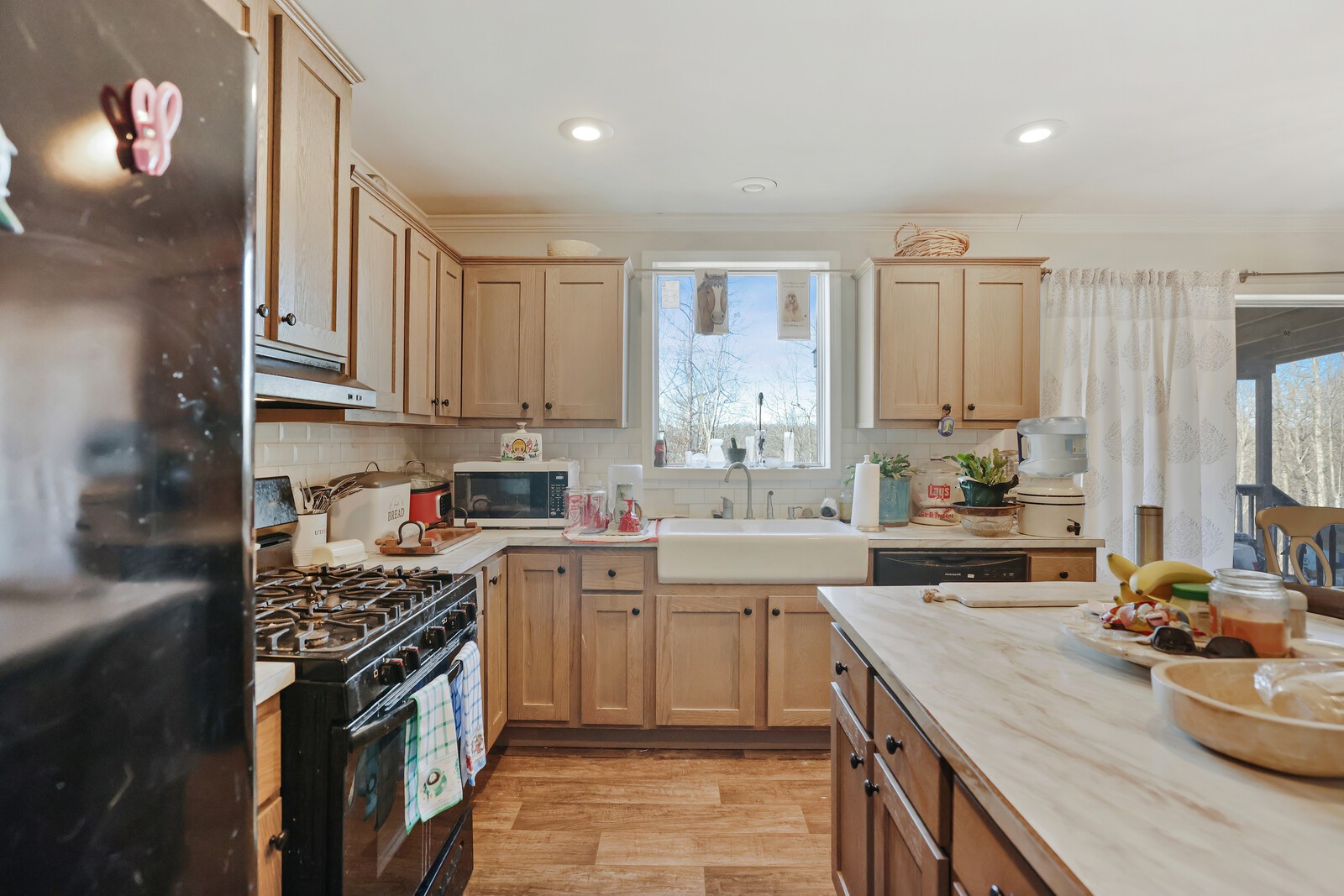 30195 White Oak Road Crawford, TN 38554 - Photo 20 of 54 a kitchen with stainless steel appliances granite countertop a stove top oven a sink dishwasher and cabinets with wooden floor