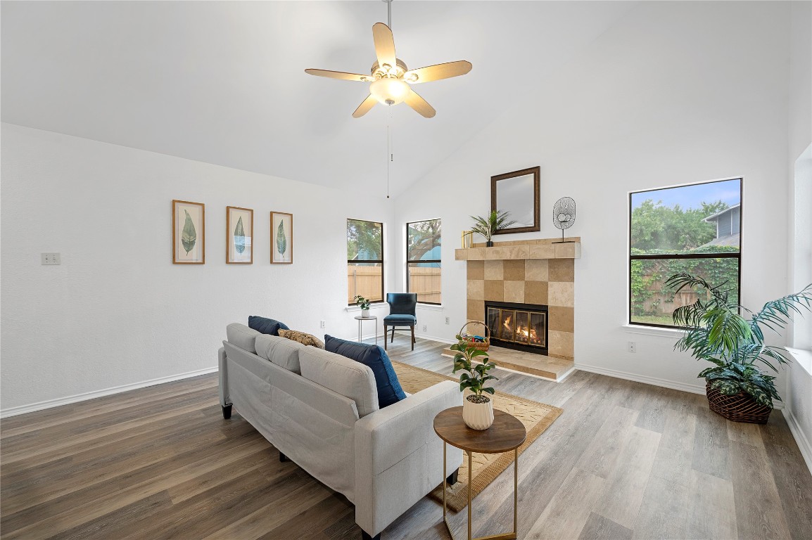 7705 Grovedale Trail Austin, TX 78729 - Photo 11 of 25 a living room with furniture and a fireplace