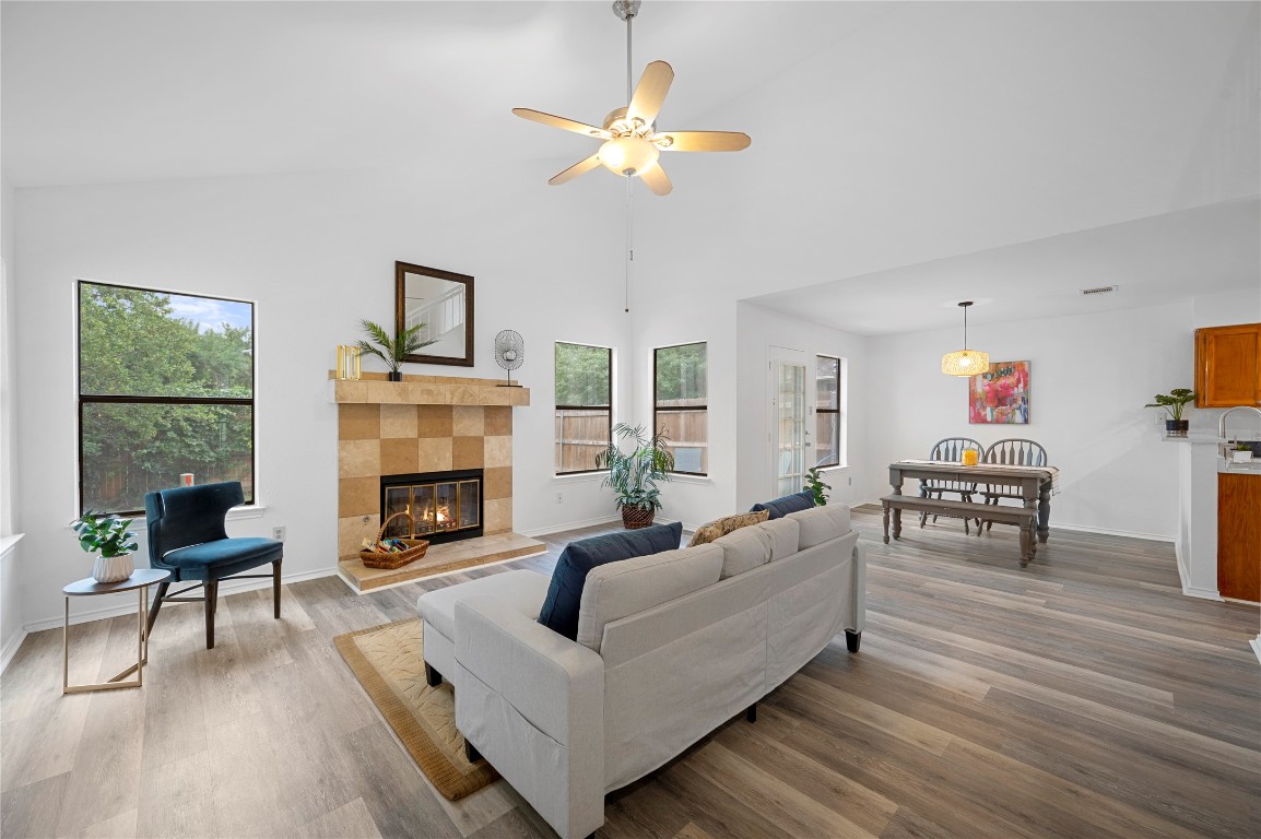 7705 Grovedale Trail Austin, TX 78729 - Photo 9 of 25 a living room with furniture and a fireplace
