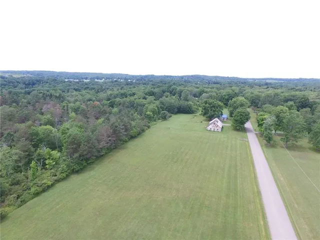 a view of a field with an outdoor space