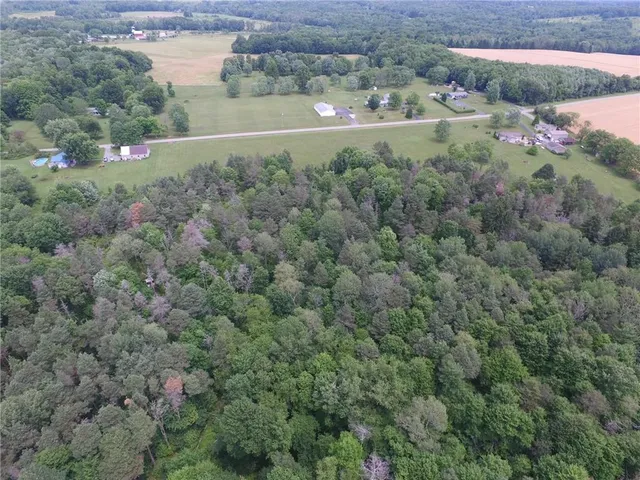 a view of a town with mountains in the background