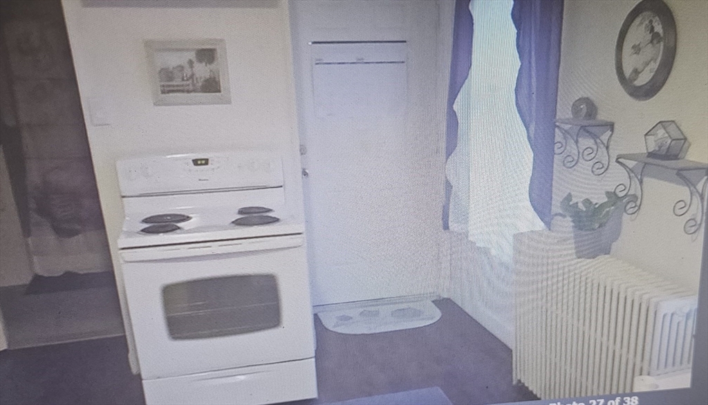 39 Union Street, Unit 1ST REAR Taunton, MA 02780 - Photo 3 of 5 a utility room with dryer and washer