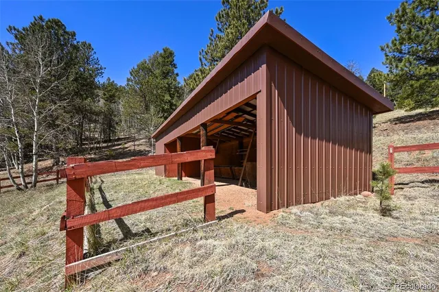 a view of a house with a yard covered in snow