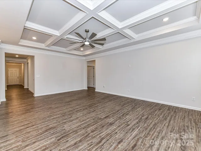 a view of a kitchen with a stove and a chandelier