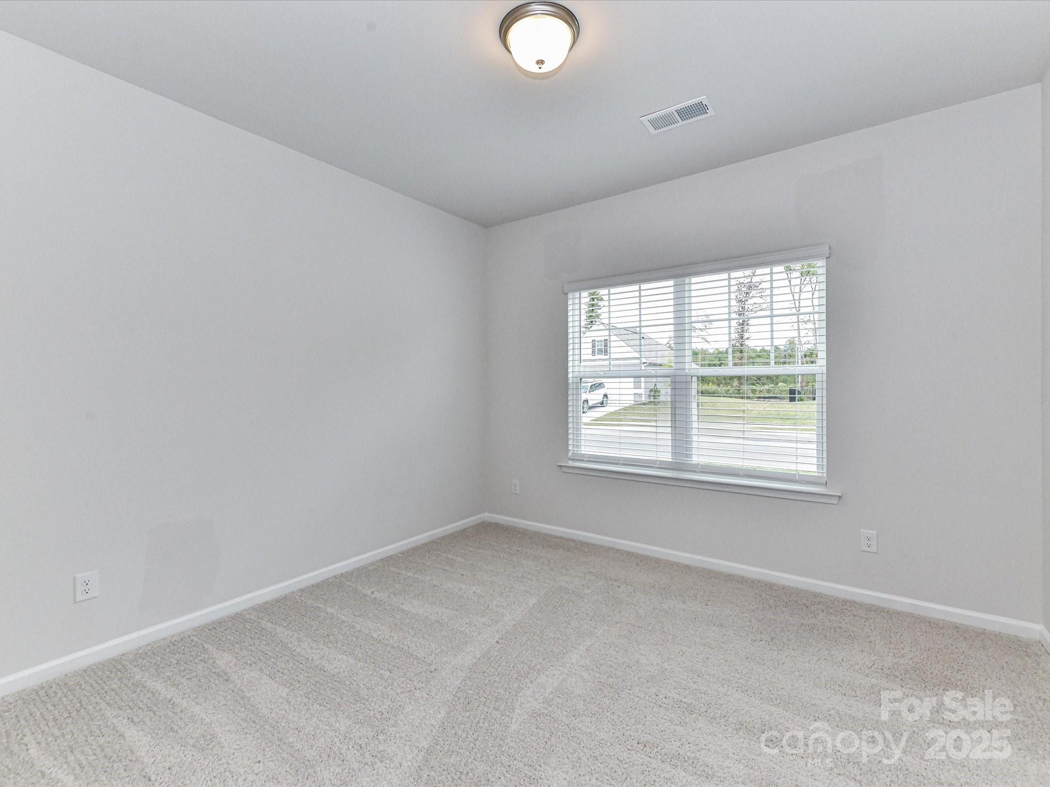 6168 Busch Way Midland, NC 28107 - Photo 29 of 42 an empty room with a window
