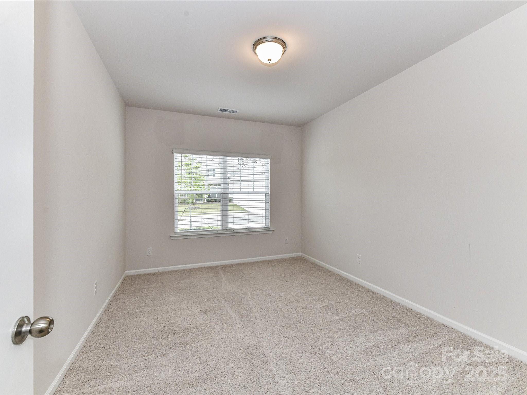 6168 Busch Way Midland, NC 28107 - Photo 32 of 42 an empty room with a window