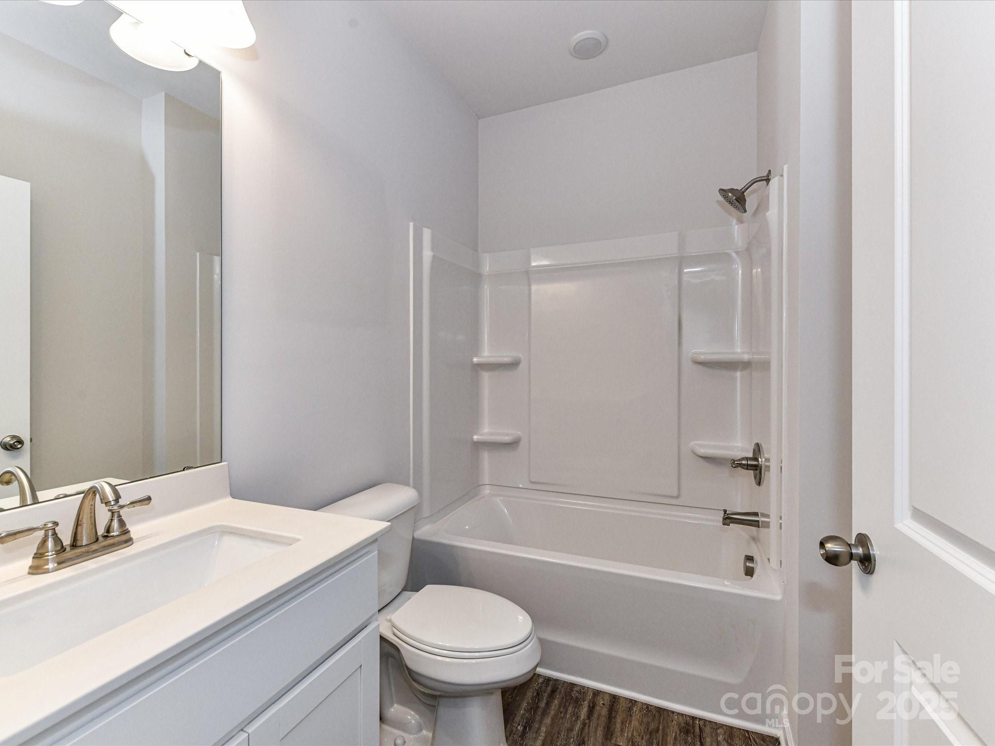 6168 Busch Way Midland, NC 28107 - Photo 34 of 42 a bathroom with a sink toilet and shower