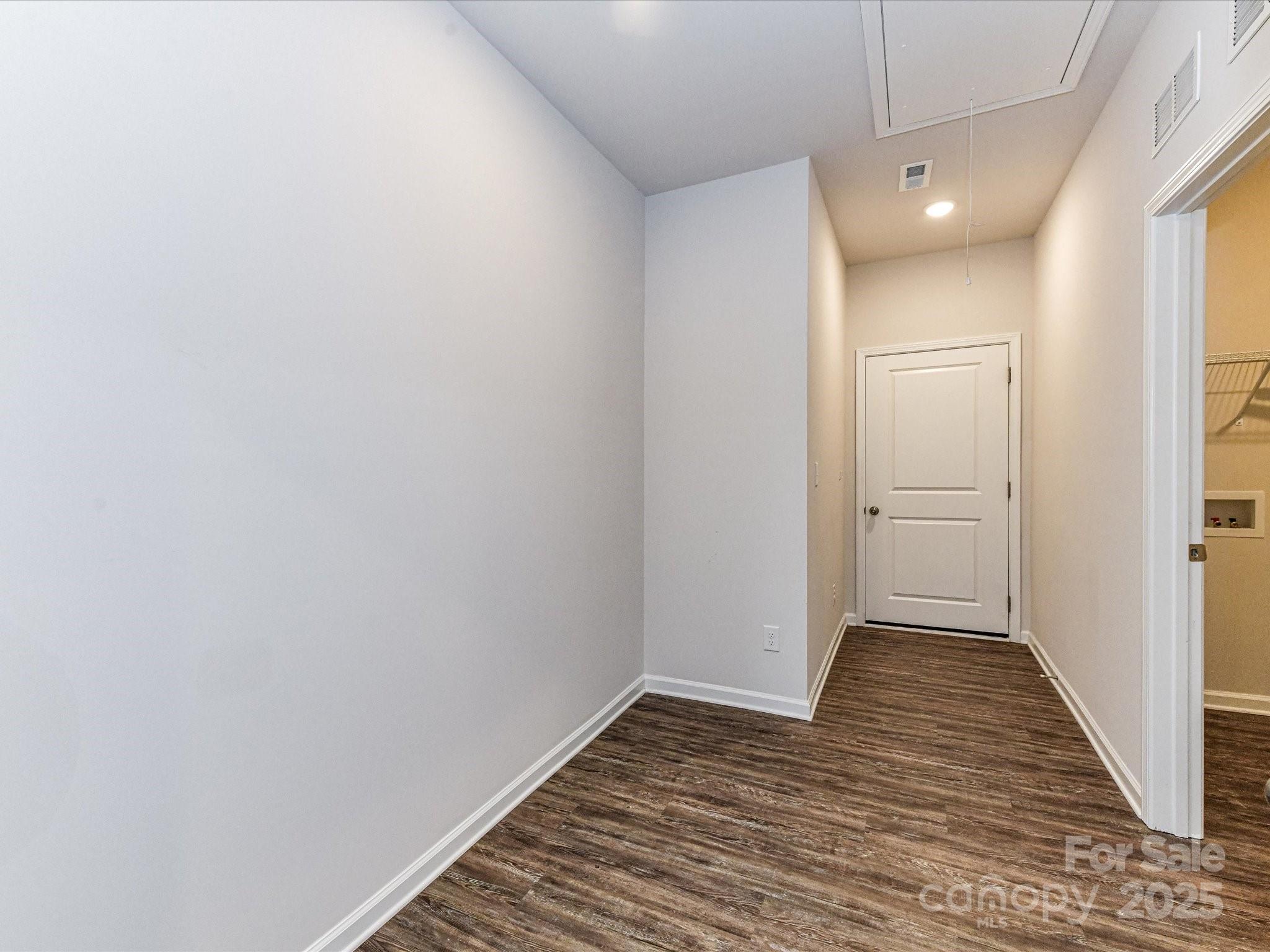 6168 Busch Way Midland, NC 28107 - Photo 36 of 42 a view of a hallway with wooden floor and a hallway