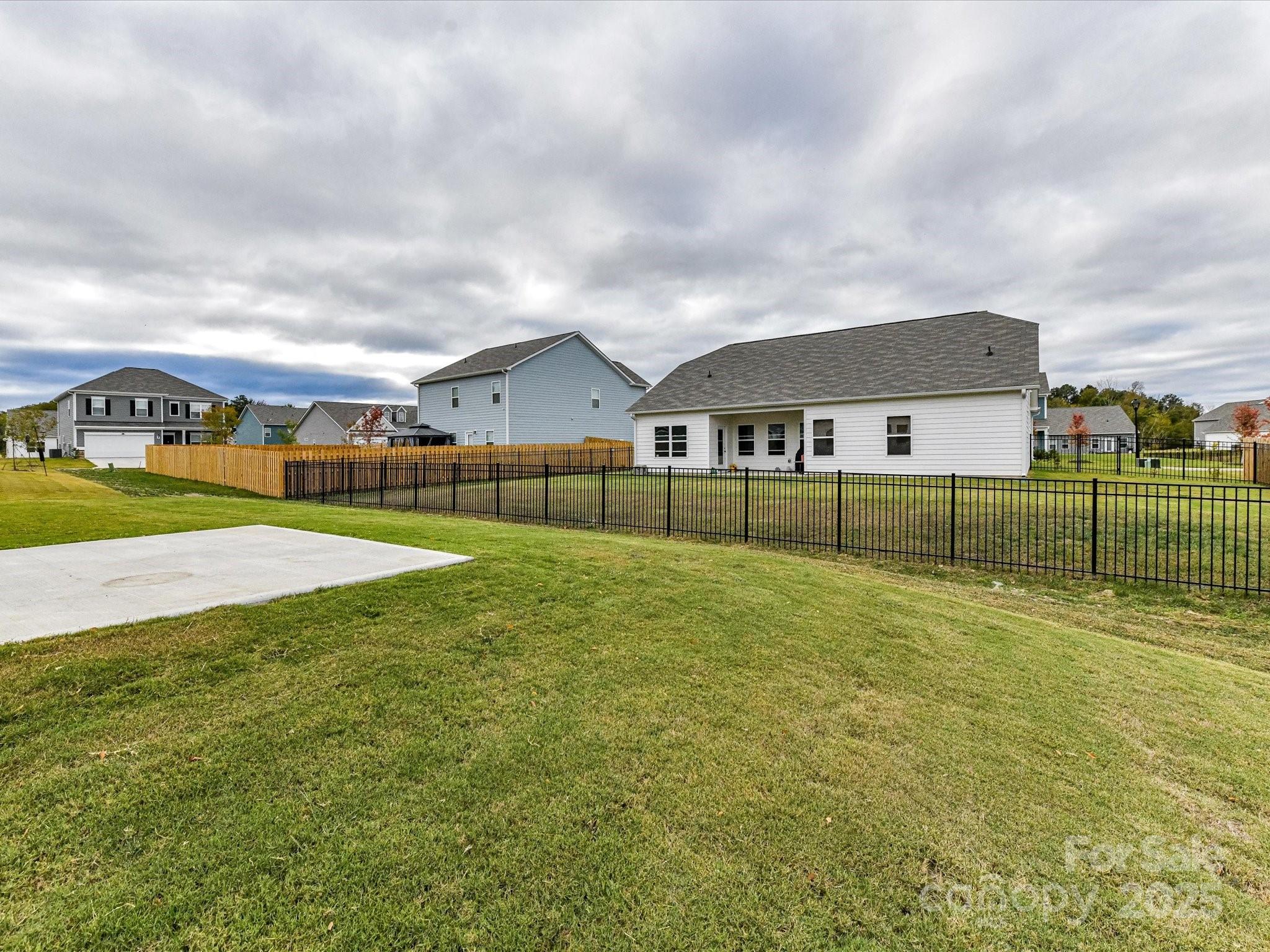 6168 Busch Way Midland, NC 28107 - Photo 39 of 42 a view of an house with a big yard and large trees