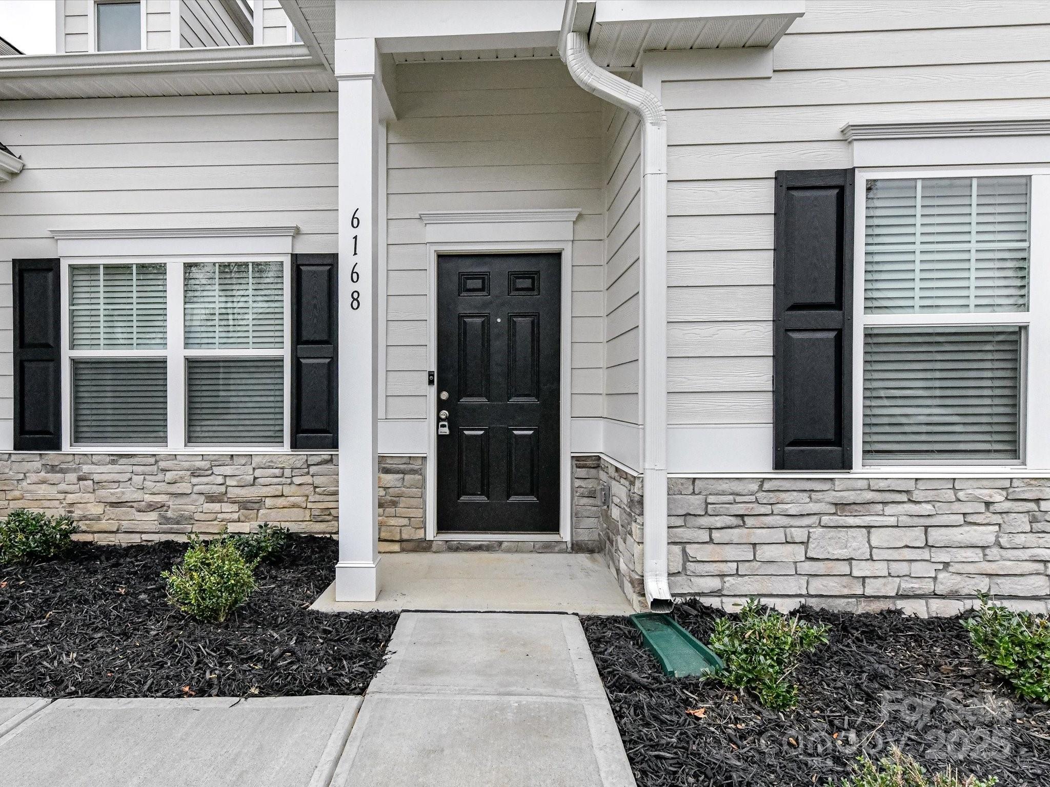 6168 Busch Way Midland, NC 28107 - Photo 4 of 42 a view of a entrance door of the house