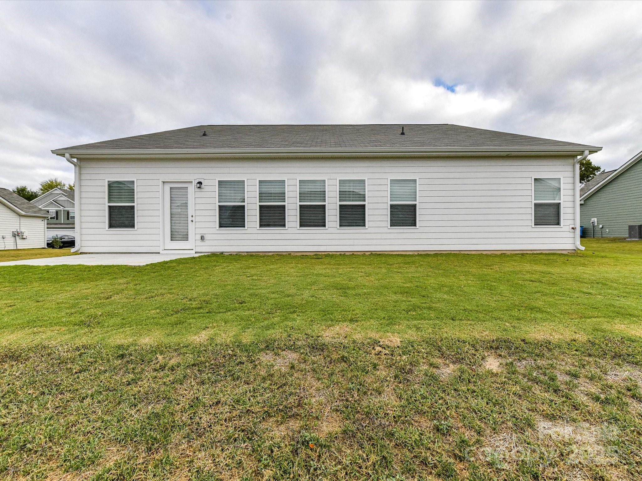 6168 Busch Way Midland, NC 28107 - Photo 42 of 42 a front view of house with yard and trees around