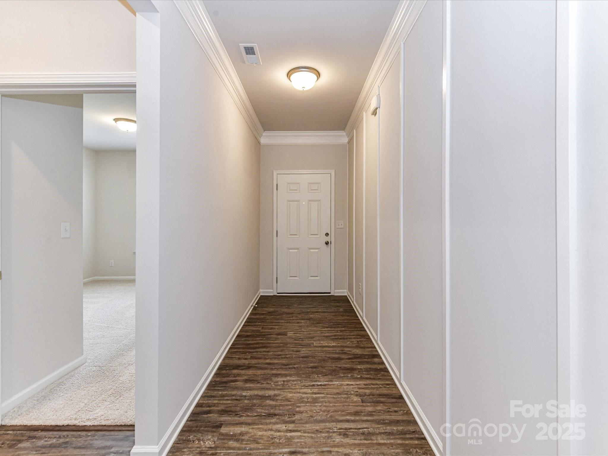 6168 Busch Way Midland, NC 28107 - Photo 6 of 42 a view of a hallway with wooden floor