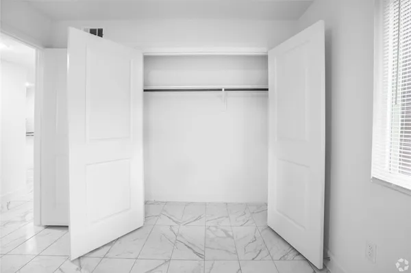 a view of walk in closet with window