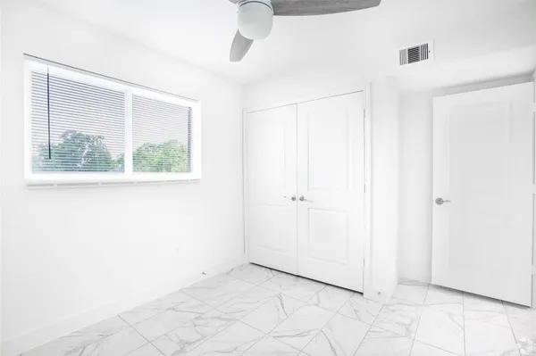 a view of an empty room with a window