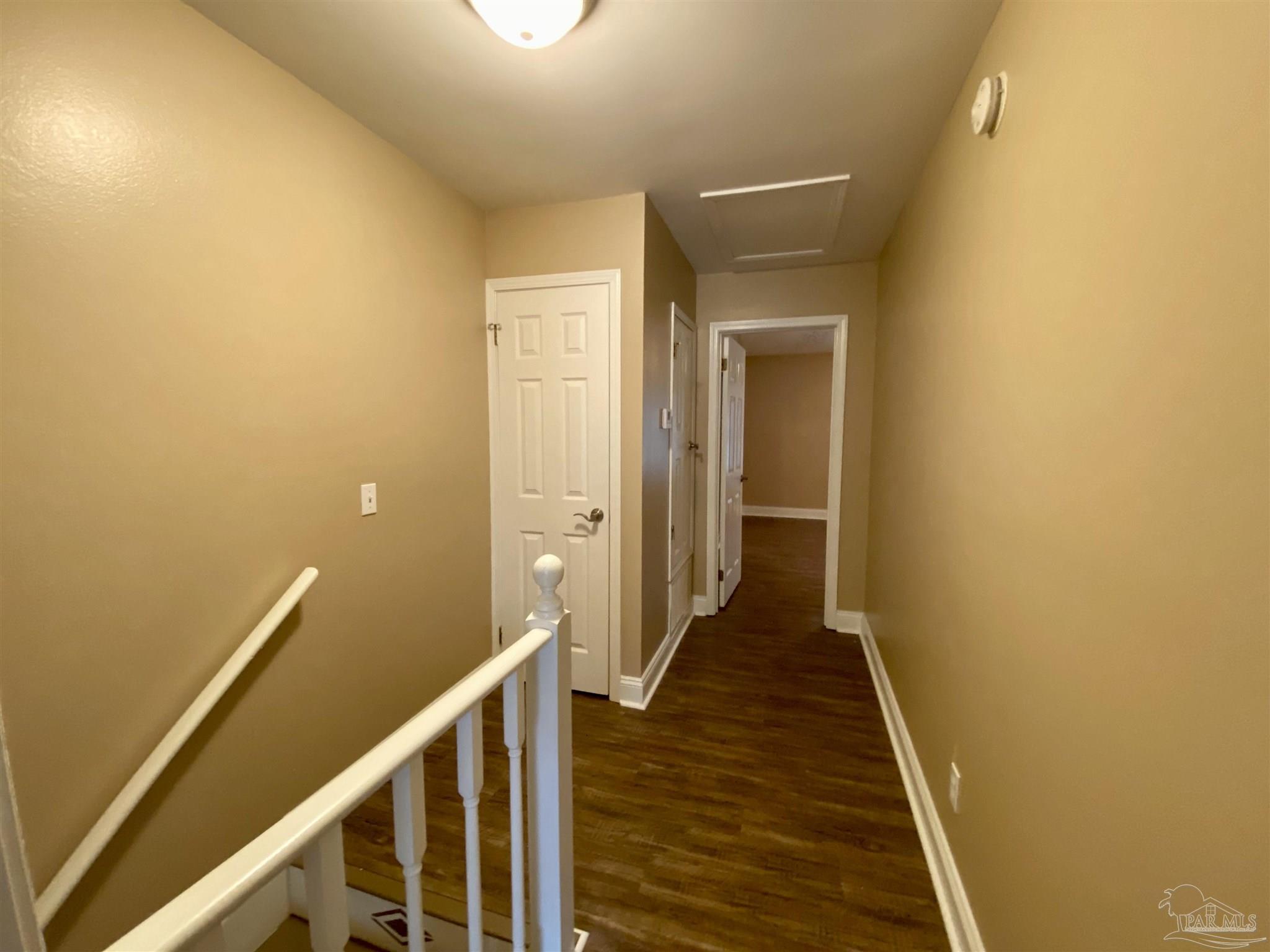 9022 Governors Pl Court Pensacola, FL 32514 - Photo 6 of 16 a view of a hallway with wooden floor