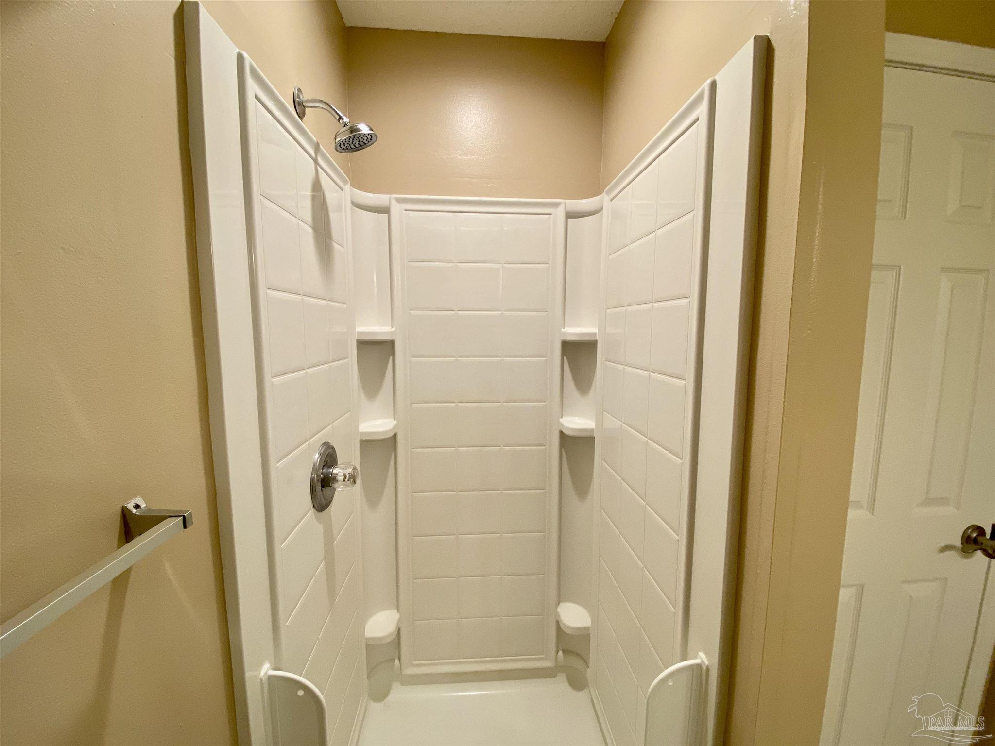 9022 Governors Pl Court Pensacola, FL 32514 - Photo 10 of 16 a bathroom with a shower and a glass door