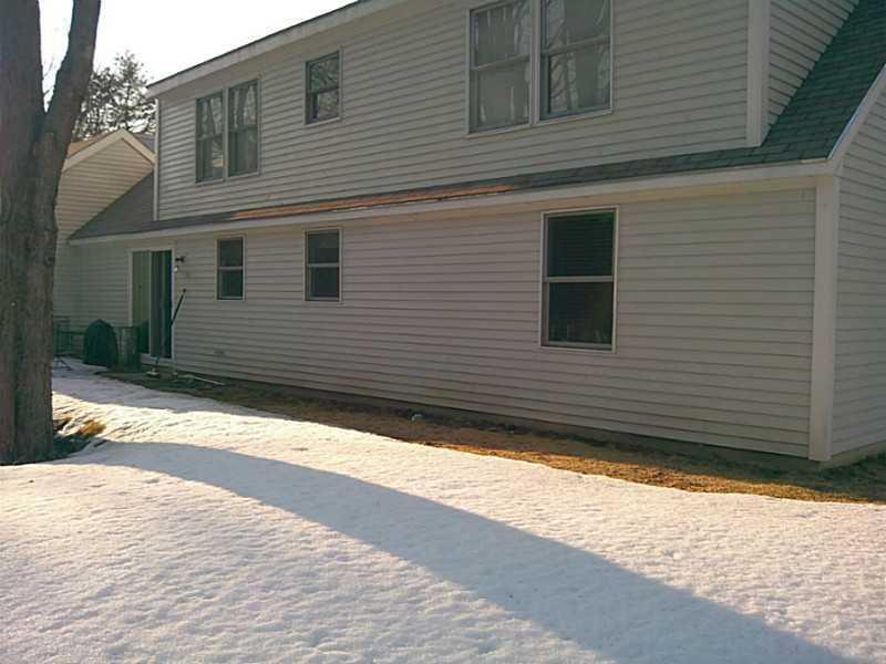 59 Willow Grove Road, Unit 59 Brunswick, ME 04011 - Photo 7 of 8 Exterior Back. Under the snow, a patio!