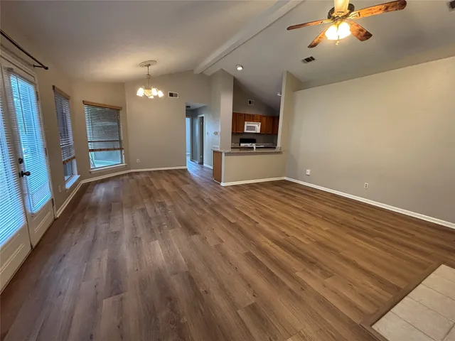 a view of livingroom with hardwood floor and a ceiling fan