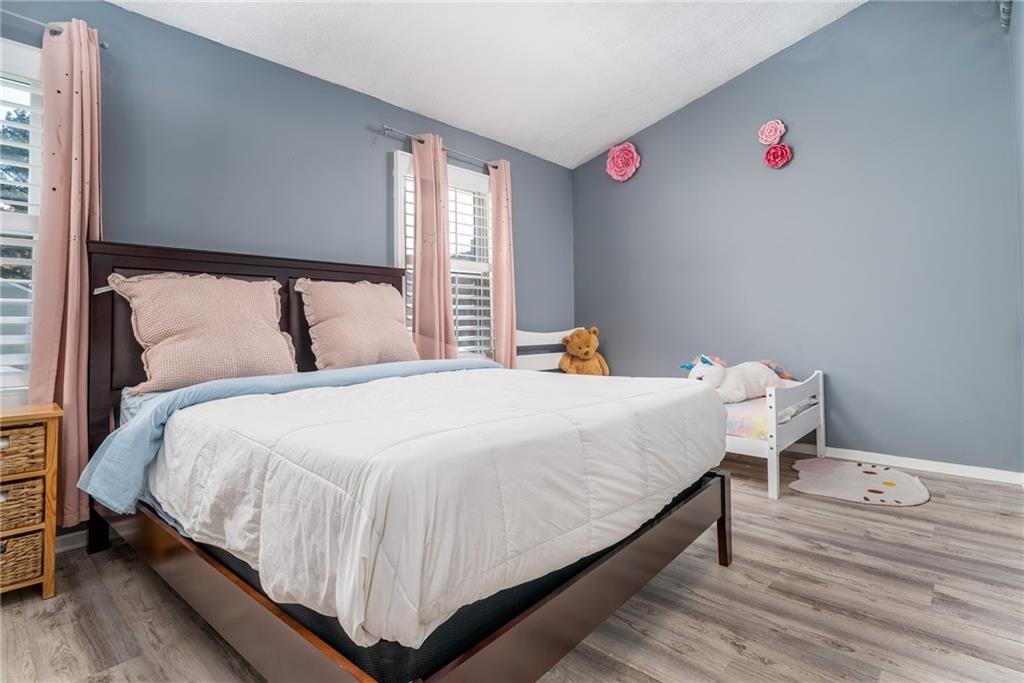 3539 Mt Vernon Circle Atlanta, GA 30340 - Photo 12 of 15 a large bed sitting in a bedroom next to a window