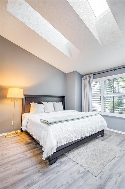 3539 Mt Vernon Circle Atlanta, GA 30340 - Photo 13 of 15 a large bedroom with a bed and large window