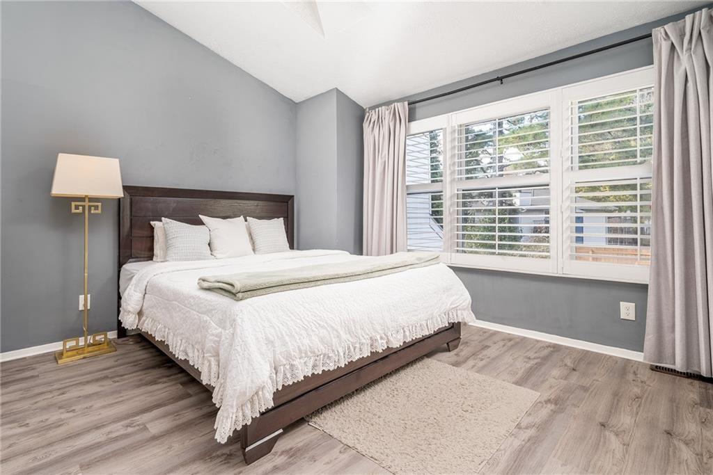 3539 Mt Vernon Circle Atlanta, GA 30340 - Photo 14 of 15 a bedroom with a large bed and a large window