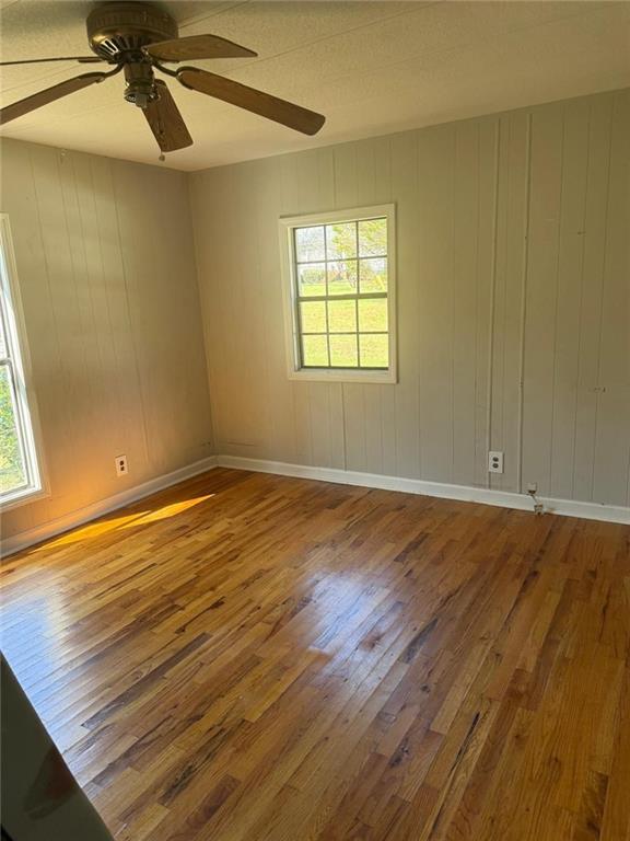 2457 Bold Springs Road Monroe, GA 30656 - Photo 11 of 23 wooden floor in an empty room with a window