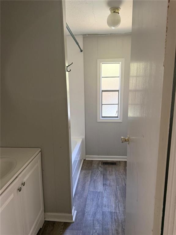 2457 Bold Springs Road Monroe, GA 30656 - Photo 15 of 23 a view of an empty room with wooden floor and a window