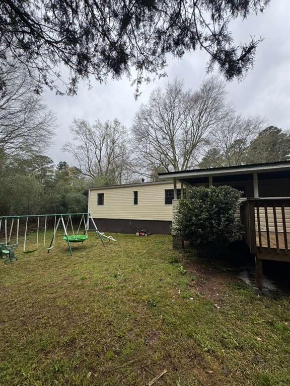 2457 Bold Springs Road Monroe, GA 30656 - Photo 22 of 23 a view of a house with a yard