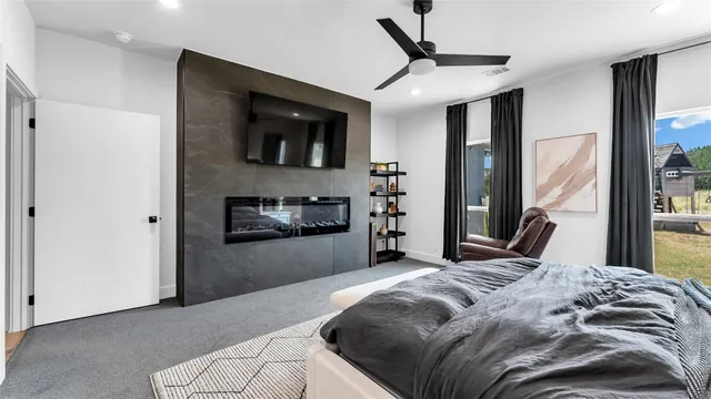 a bedroom with a bed and a television