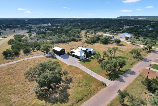 an aerial view of a house with a garden