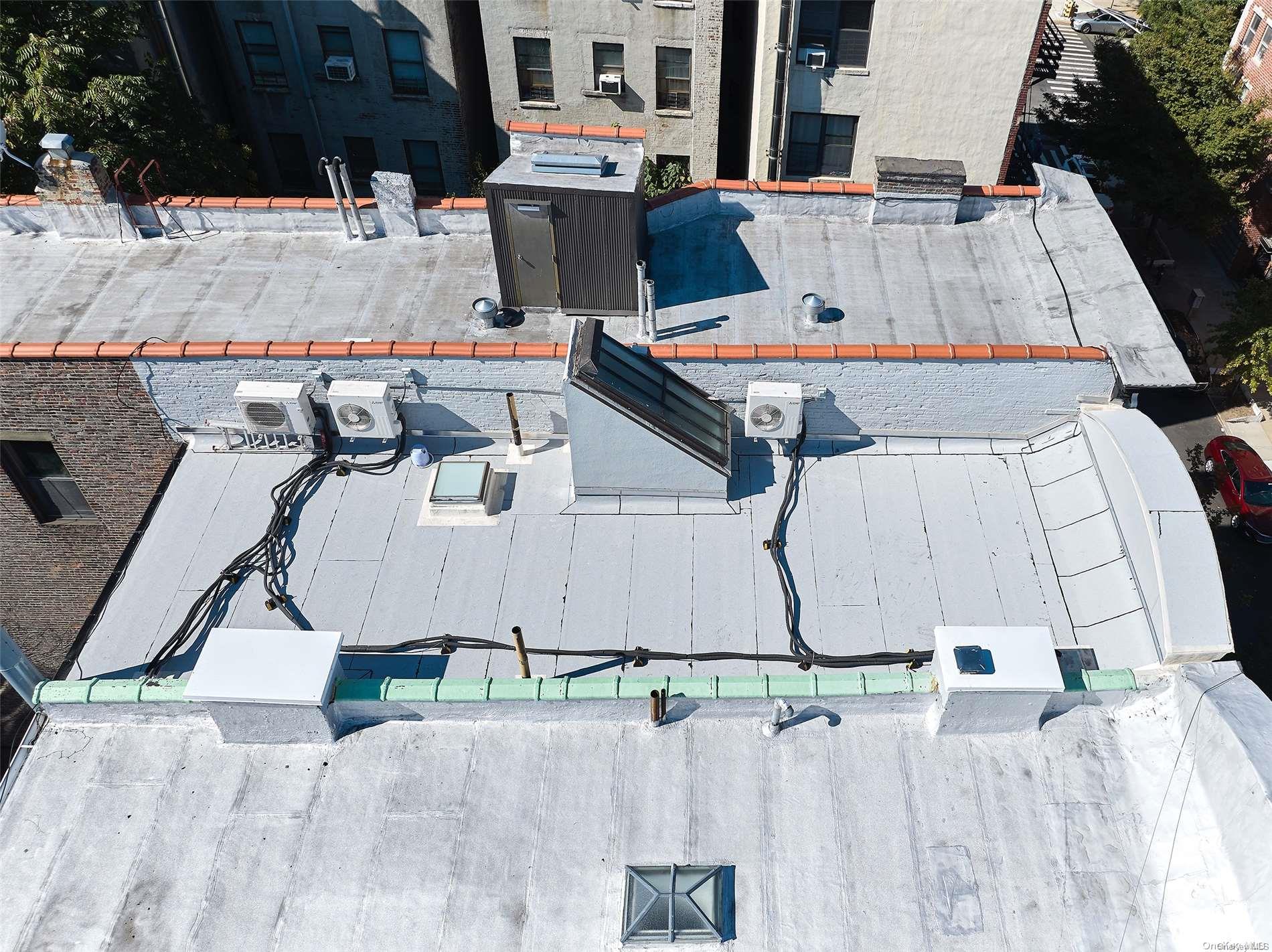 266 West 136th Street Manhattan, NY 10030 - Photo 6 of 22 an aerial view of a house with swimming pool