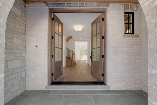 a view of a hallway with windows