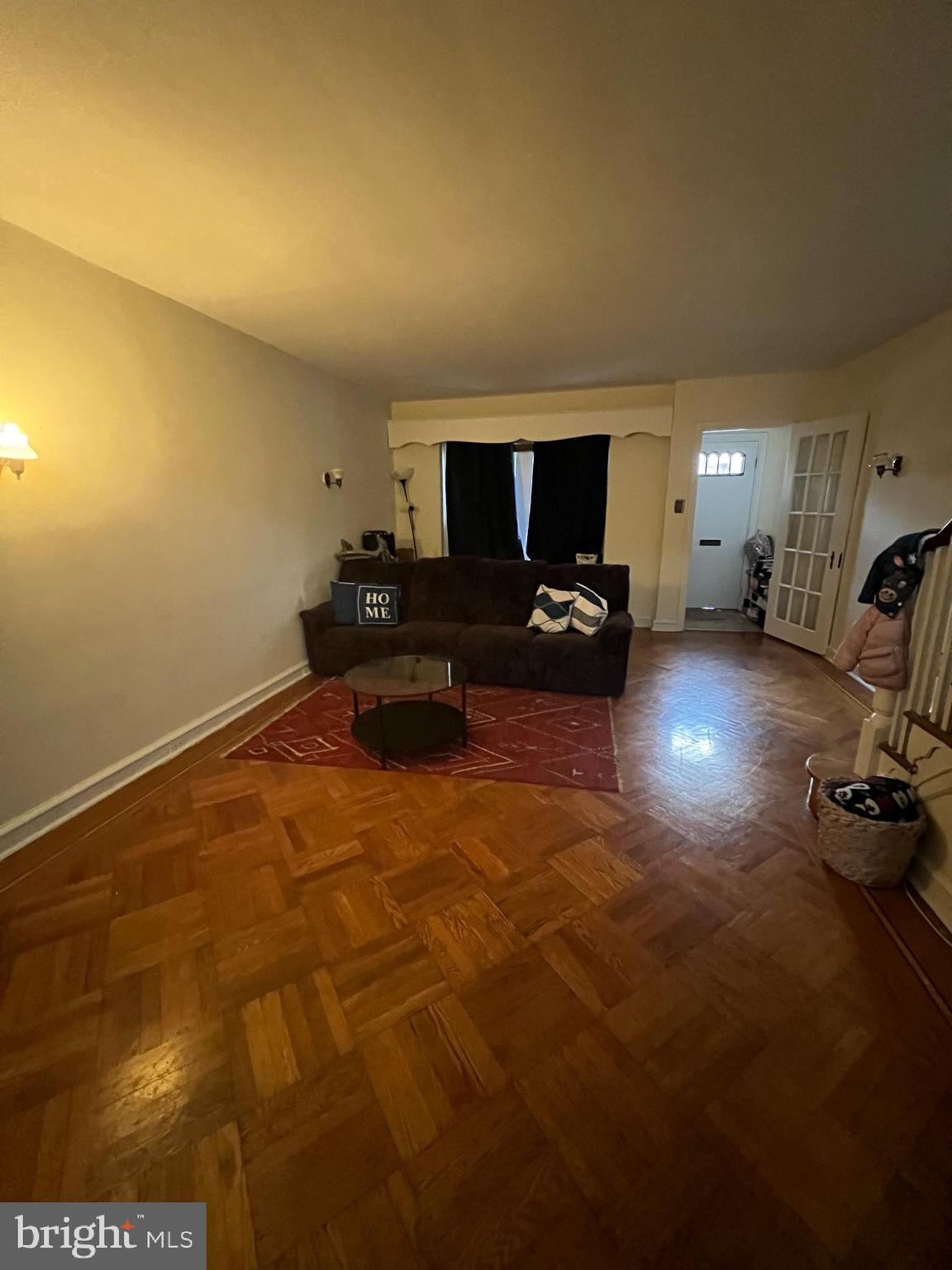 3158 Fanshawe Street Philadelphia, PA 19149 - Photo 4 of 8 a living room with furniture a flat screen tv and a fireplace