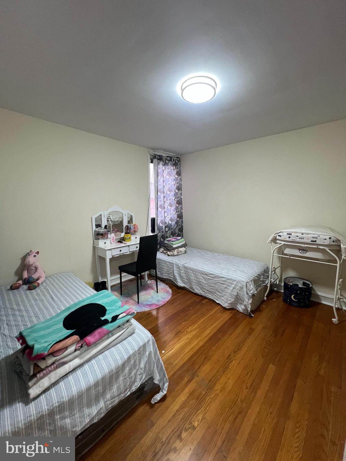3158 Fanshawe Street Philadelphia, PA 19149 - Photo 5 of 8 a bedroom with furniture and a wooden floor