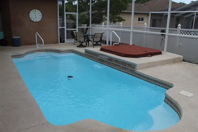 a view of a kitchen with a sink and cabinets